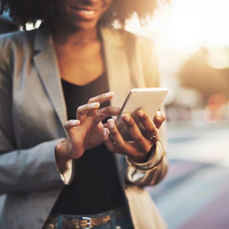 Woman texting on phone - CONTEMPORARY CARPET & FLOORING in FL